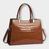 Olivia - Glossy Crocodile raksts rokassoma