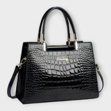 Olivia - Glossy Crocodile raksts rokassoma