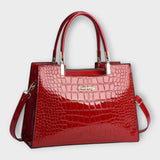 Olivia - Glossy Crocodile raksts rokassoma