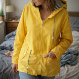 Damen Regenjacke mit langen Ärmeln, Kapuze und Taschen