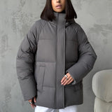 Damen Oversized Steppjacke mit Kapuze und integrierten Taschen
