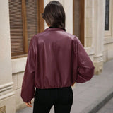 Damen cropped Kunstlederjacke mit Reißverschlusstaschen und tailliertem Schnitt