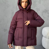 Damen Oversized Steppjacke mit Kapuze und integrierten Taschen