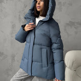 Damen Oversized Steppjacke mit Kapuze und integrierten Taschen