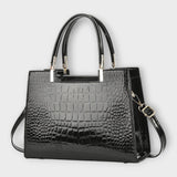 Olivia - Glossy Crocodile raksts rokassoma