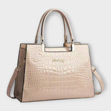 Olivia - Glossy Crocodile raksts rokassoma